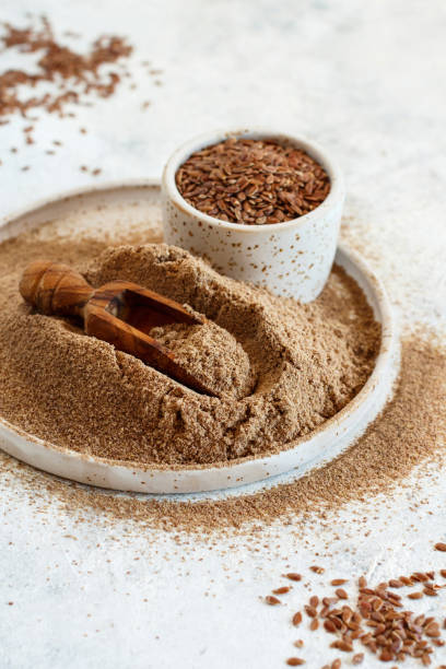 istock Raw Flax seeds flour in a plate with a spoon 1311687049