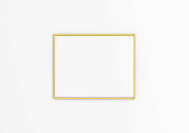 istock Single 10x10 Horizontal gold Frame mockup on white wall. 1311688289