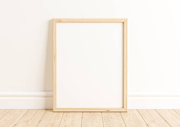 istock Single 8x10 Vertical beige Frame mockup on wooden floor and white wall. 1311691371