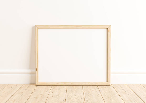 istock Single 8x10 Horizontal beige Frame mockup on wooden floor and white wall. 1311691372