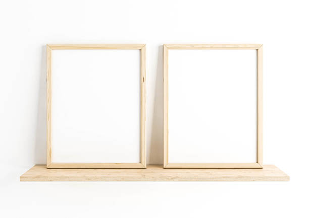 istock Double 8x10 Vertical beige Frame mockup on wooden shelf and white wall. 1311691384