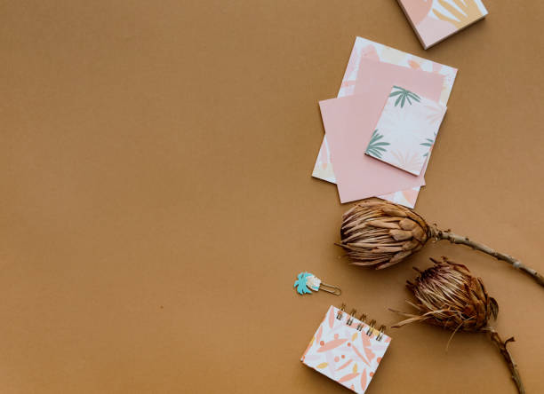 istock Flat lay minimal composition. Creative concept dry flowers and invitation cards. Top view, copy space 1311693582