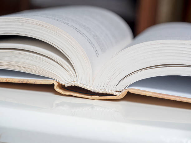 istock a thick open book lies on a white background. The concept of learning and knowledge 1311694618