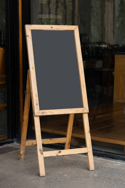 istock Old whiteboard stand in front of restaurant 1311695775