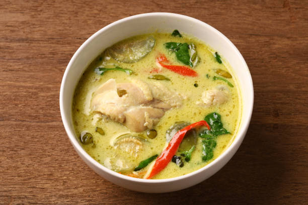 istock Chicken drumstick green curry in round bowl 1311695779