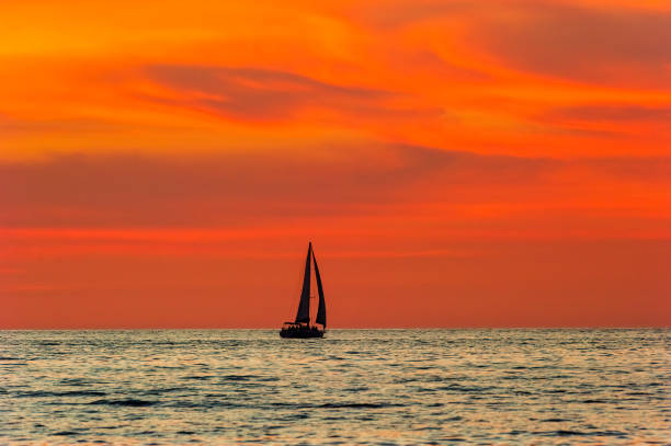 istock Sunset Ocean Sailboat Dusk 1311703125