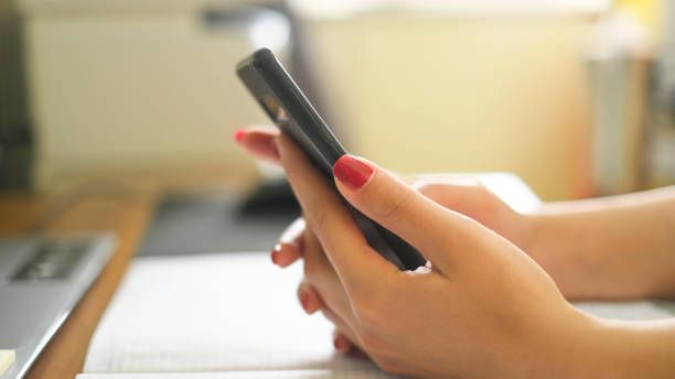istock Woman close up use smartphone while studying,social network tech addiction 1311704068