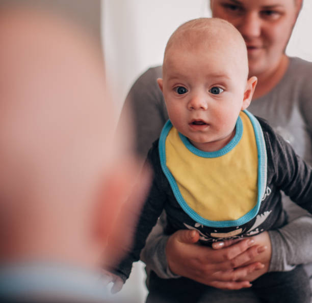 istock Baby looking at mirror and wondering 1311707660