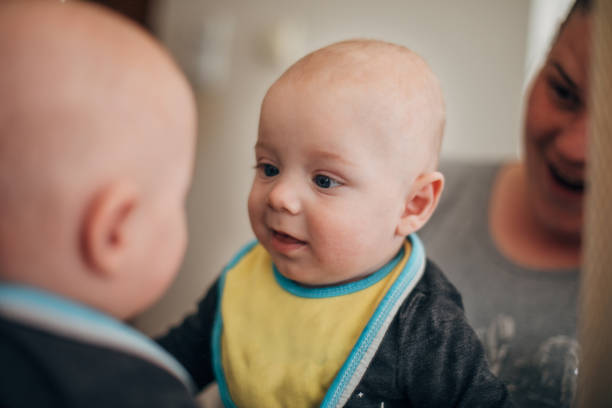 Baby smile at him self in mirror
