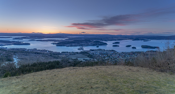 Sunset over Steinsfjorden, a branch of Lake Tyrifjorden located in Buskerud, Norway. View from Kongens Utsikt (Royal View) at Krokkleiva, Viken fylke.