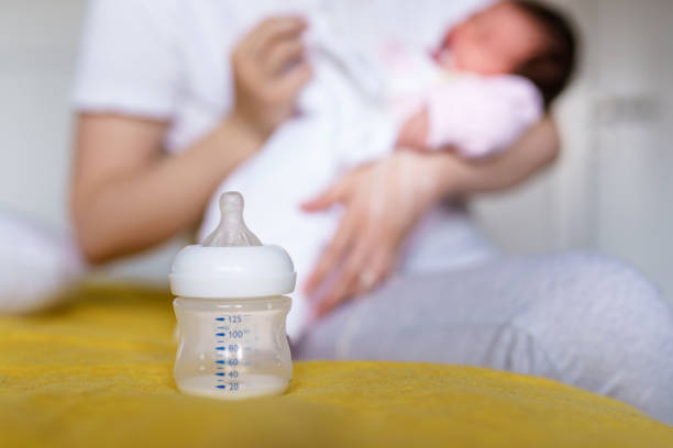istock Bottle feeding concept artificial formula food milk for babies copy space 1311712043