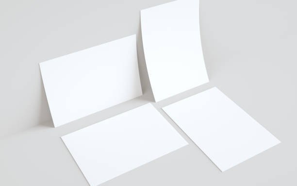 istock A4 Flyer / Letterhead Mock-Up - Two Flyers Against Wall Background 1311712390