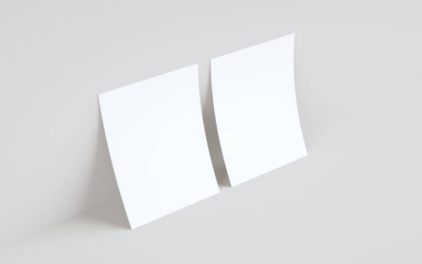 istock A4 Flyer / Letterhead Mock-Up - Two Flyers Against Wall Background 1311712394