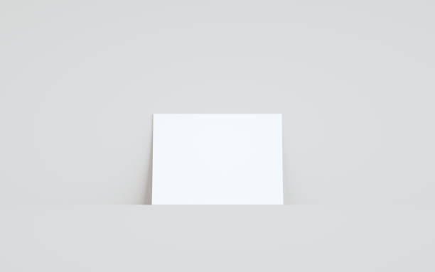 istock A5 Flyer / Brochure Mock-Up - One Flyer Against Wall Background 1311712399