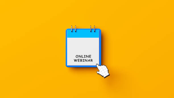 istock Webinar concept Blue-colored calendar with online webinar text on yellow-colored background 1311725315