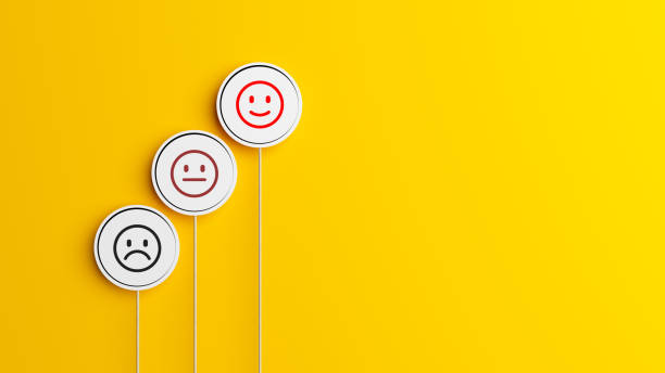 istock Feedback concept Black framed speech bubble and feedback facial expression on yellow-colored 1311725915
