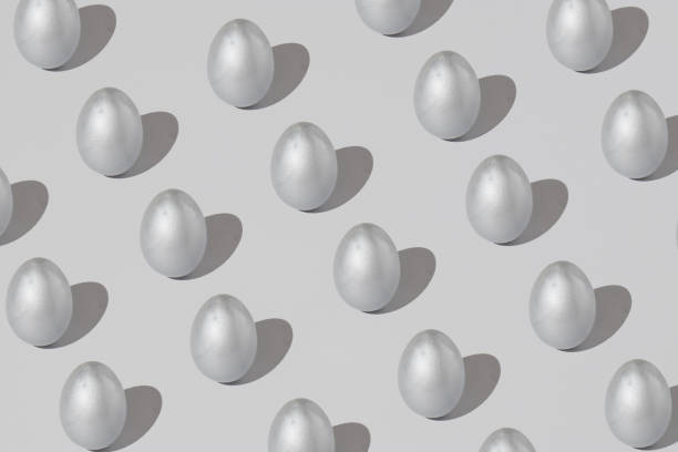 istock Pattern made of silver easter egg on a gray background. Minimal holiday concept. Flat lay, top view. 1311731711