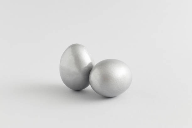 istock Silver easter egg composition on a gray background. Minimal holiday concept. Flat lay, top view. 1311731732