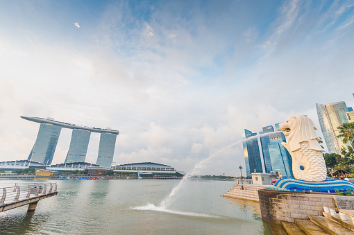 Singapore, Singapore - July 19, 2014: The Merlion, the landmark of Singapore, and a blue and sunny sky at the back