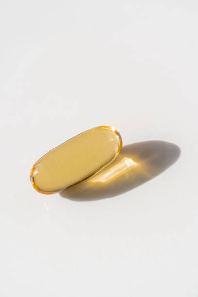 istock Oil filled capsules on the white background 1311736044