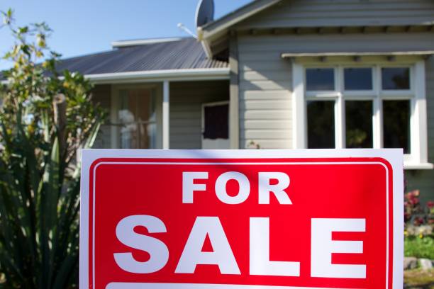 istock For Sale Sign Outside House 1311736867