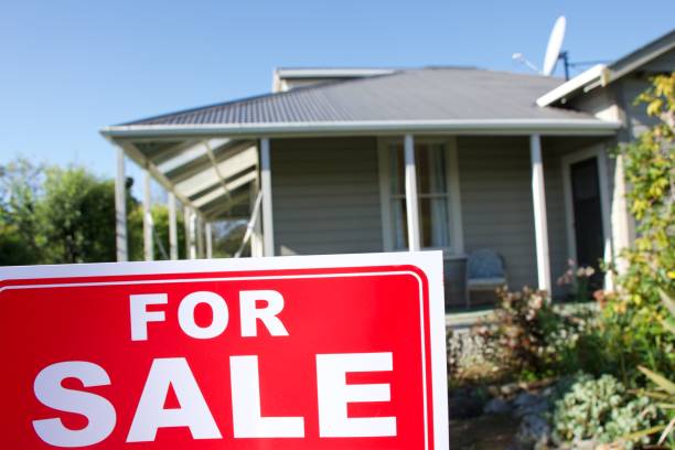 istock For Sale Sign Outside House 1311736903