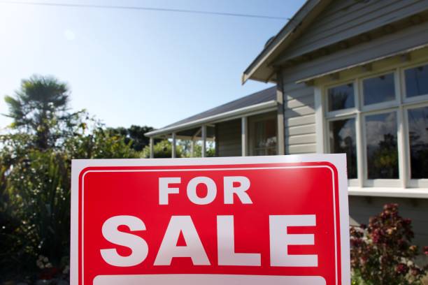 istock For Sale Sign Outside House 1311736924