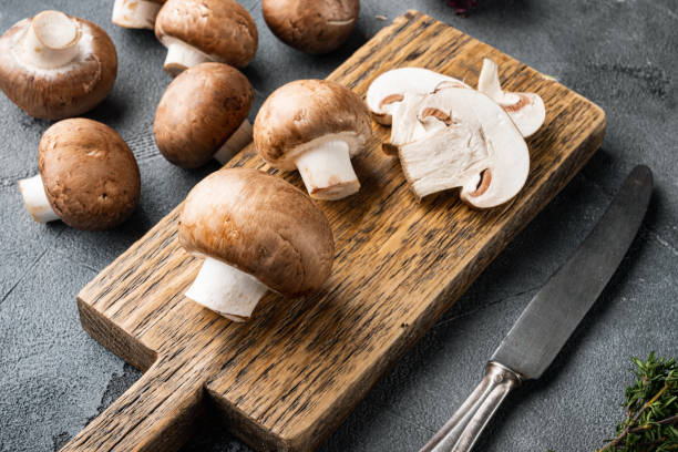 istock Royal mushrooms champignon whole, on gray background 1311738433