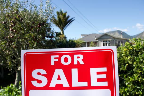 istock For Sale Sign Outside House 1311739254