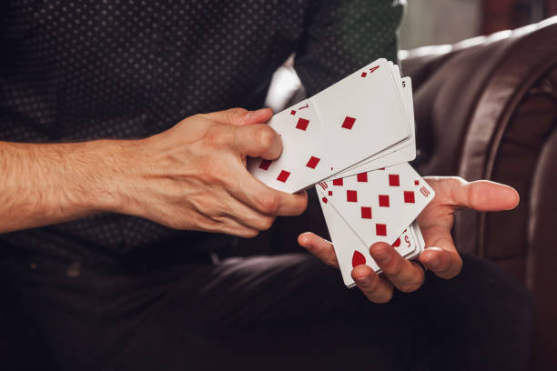 istock Clever hands of magician on black background 1311740199