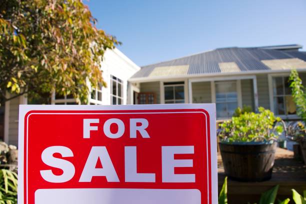 istock For Sale Sign Outside House 1311740473