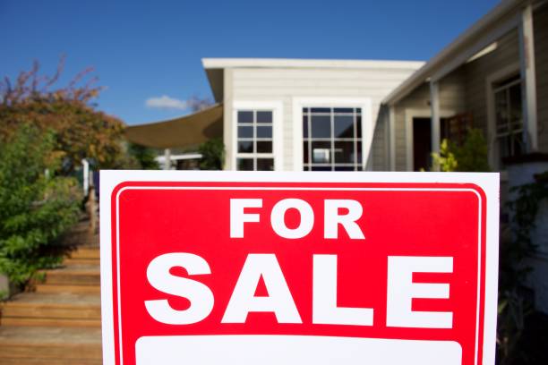 istock For Sale Sign Outside House 1311741017