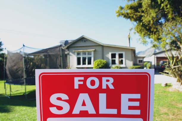 istock For Sale Sign Outside House 1311741042