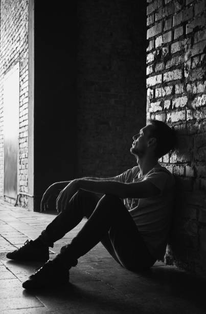 istock Young man on street classicism black and white photo. 1311741141