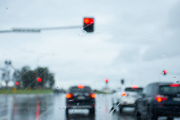 istock Blurred defocused image of the rain through the windscreen in Australia. Rain background 1311741350