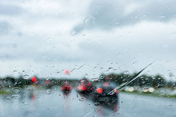 istock Blurred defocused image of the rain through the windscreen in Australia. Rain background 1311741369