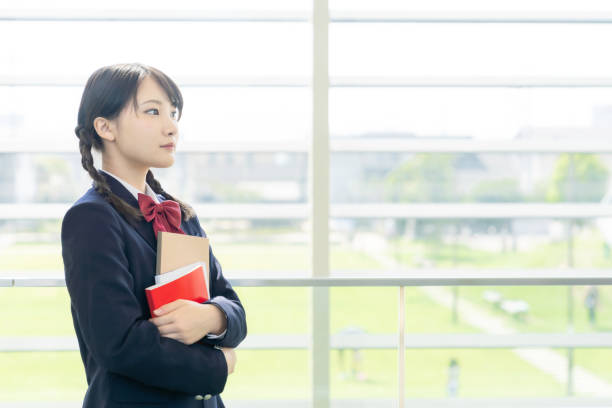 istock Asian female high school student in school building. 1311742073