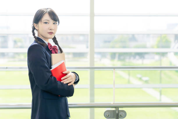istock Asian female high school student in school building. 1311742081