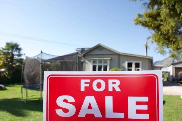 istock For Sale Sign Outside House 1311743155
