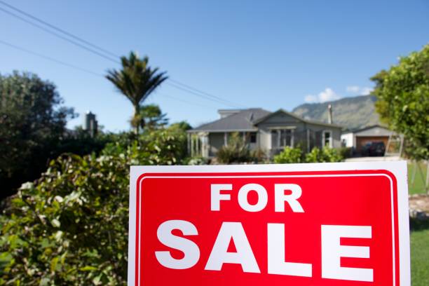istock For Sale Sign Outside House 1311743189