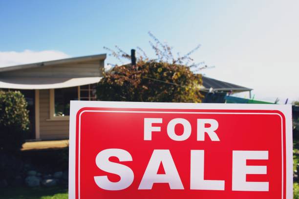 istock For Sale Sign Outside House 1311743942