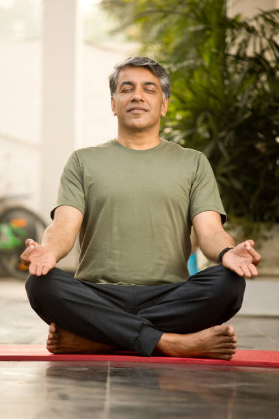 istock Man meditating in lotus position 1311744099
