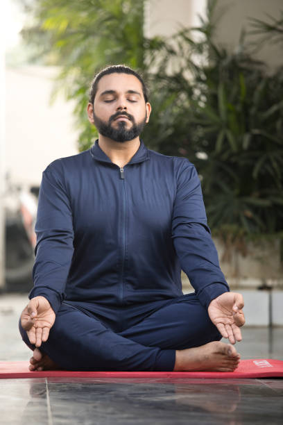istock Man meditating in lotus position 1311745004