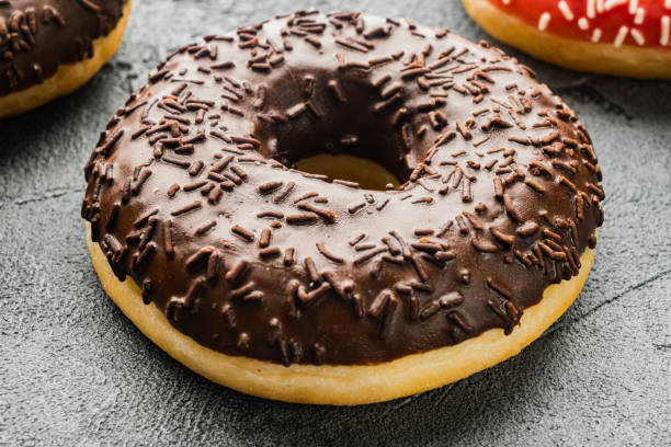 istock Homer donuts chocolate, on gray background 1311746010