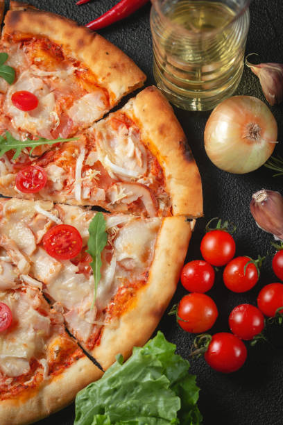 istock Cooking pizza. Ingredients and spices for making homemade pizza. Top view with copy space. Pizza on table composition. 1311747021