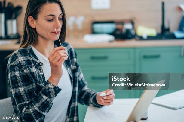 Woman Holding Selftesting Swab And Rapid Test For Coronaviruscovid19 Stock Photo - Download Image Now