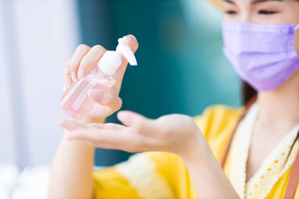 istock traveler use alcohol hand sanitizer 1311748061
