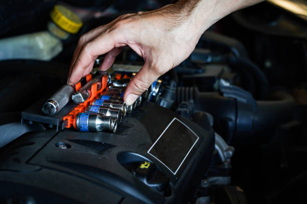 istock Auto mechanic working in garage. Repair service,Car check concept 1311753919
