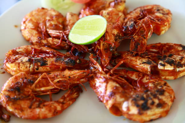 istock Indonesian style grilled prawn with lime 1311759296