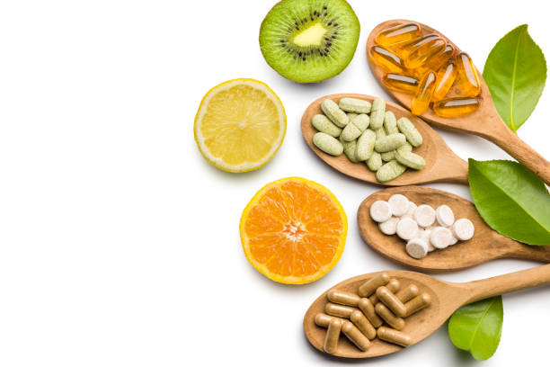 píldoras vitamínicas - nutritional supplement fotografías e imágenes de stock